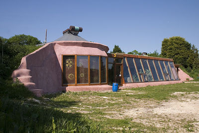 The design used with most earthships. A large series of windows  and the use of tires characterize the earth sheltered building